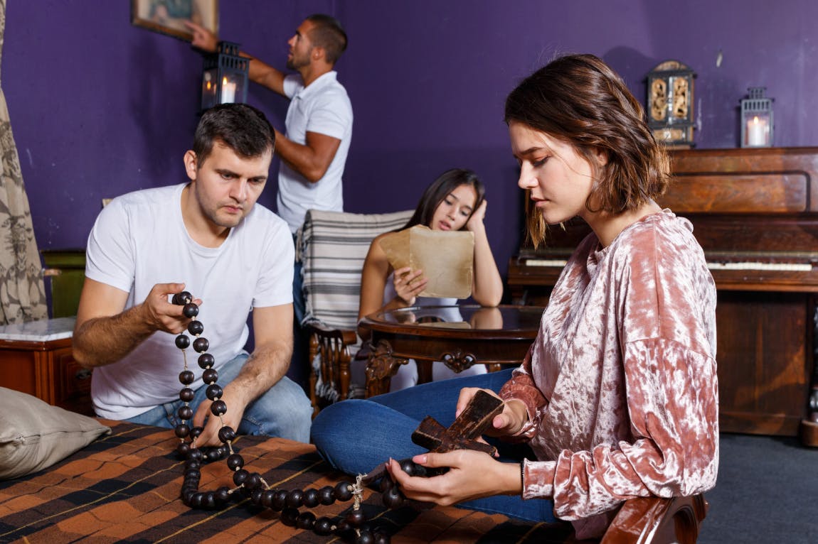 Friends solving clues in an escape room