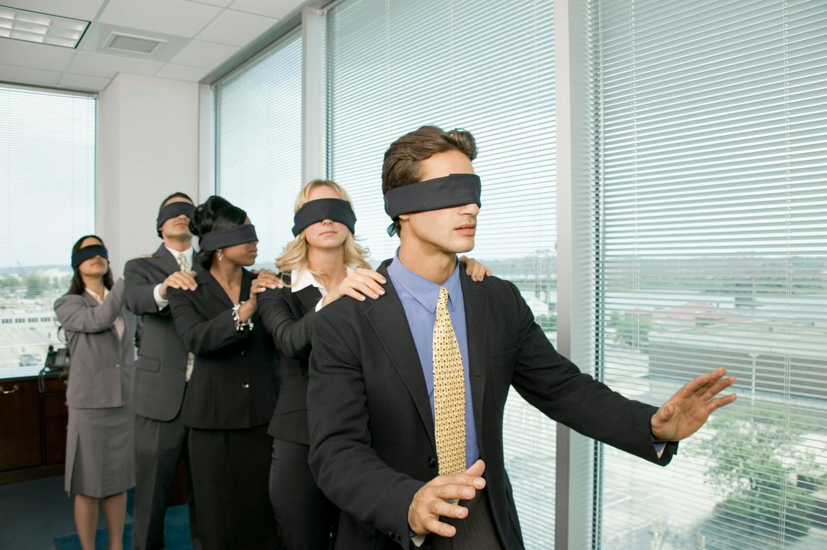 Colleagues playing a blindfolded game